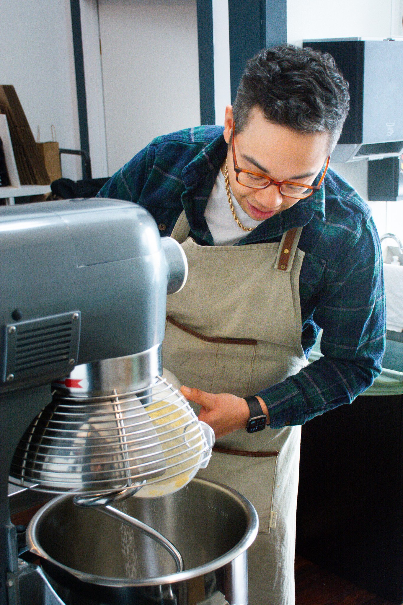 Maker preparing ingredients with a stand mixer during a lifestyle branding photo shoot