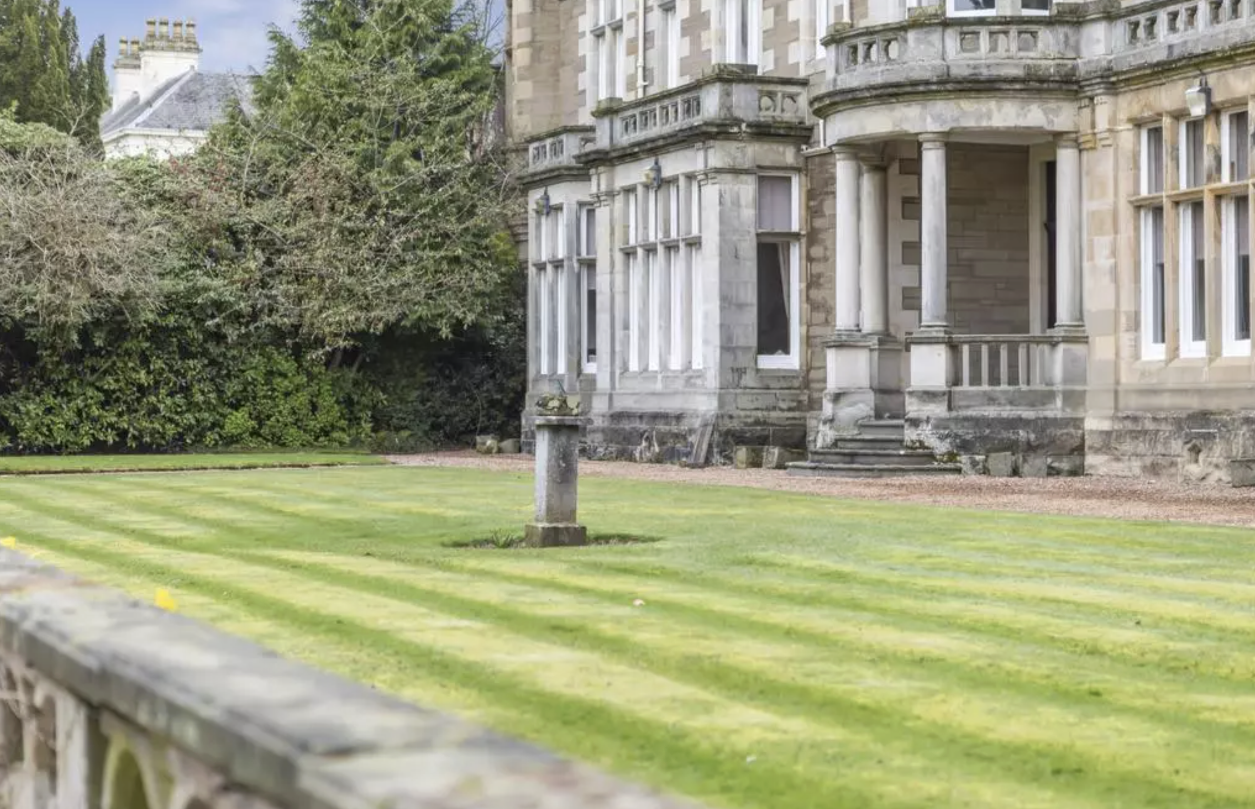 garden view of north wood house 1880 flexible workspace dundee showing sundial and victorian house