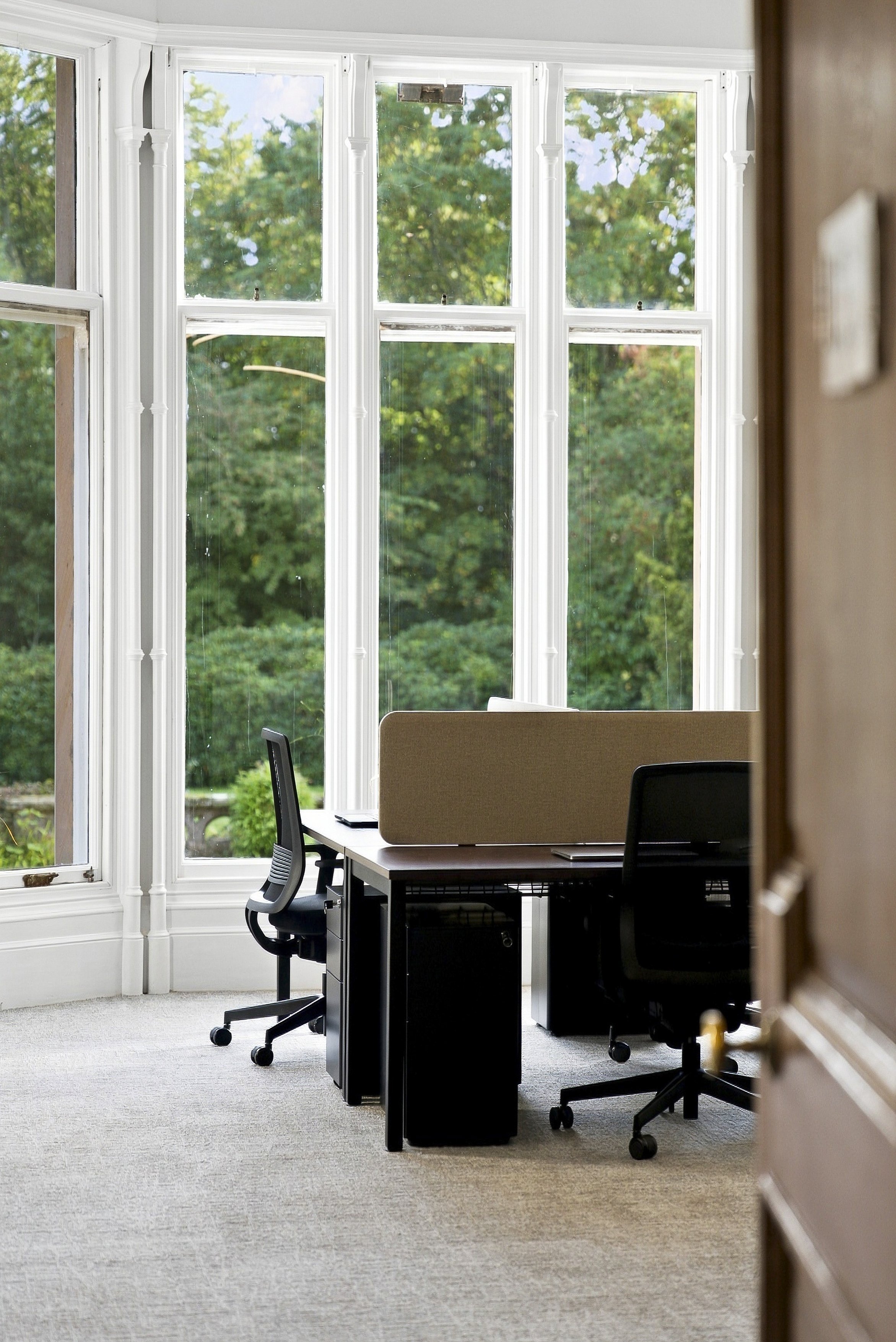 Shot of dedicated desks for rent in coworking space Dundee Broughty Ferry