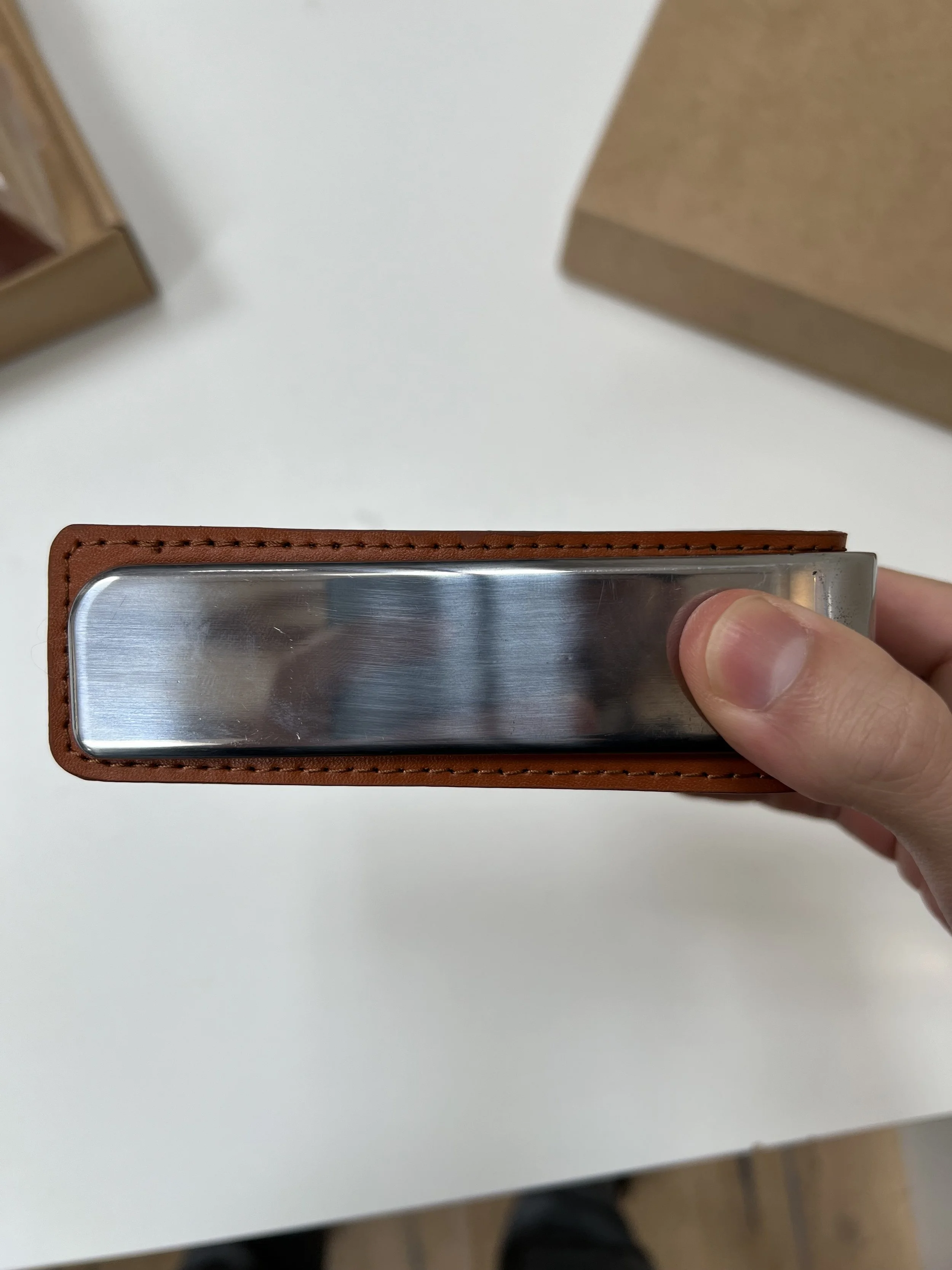 Leather and frame combined without visible external fasteners