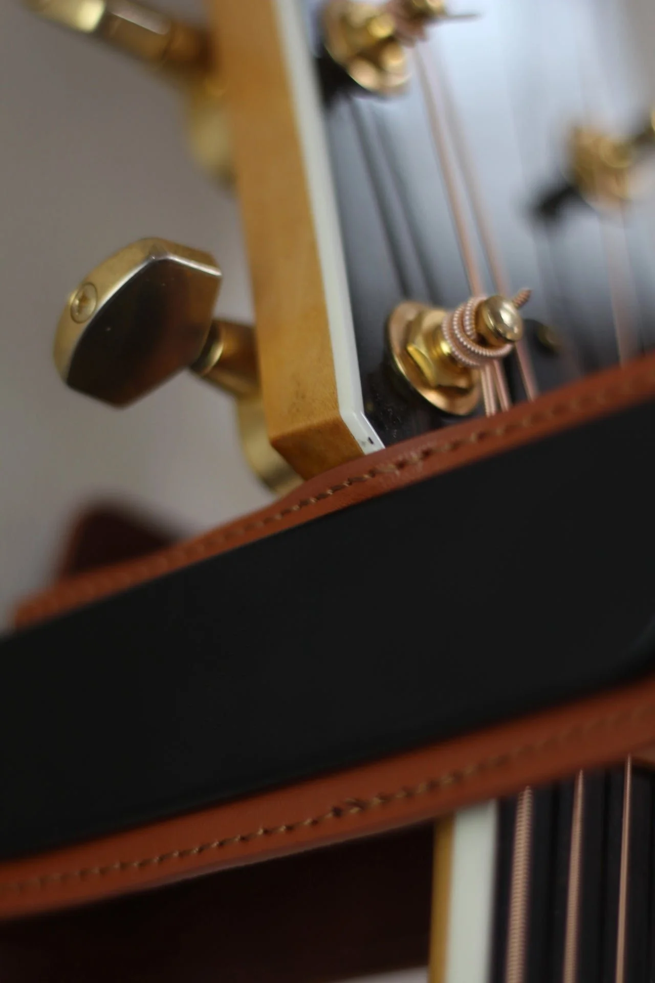 The guitar creates it's own unique mark the leather over time