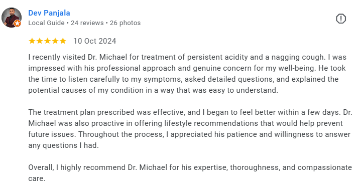 Screenshot of a Google review for Dr. Michael, expressing satisfaction with treatment for persistent acidity and cough, highlighting professionalism, thoroughness, and caring attitude. Médecin généraliste Français à Dubaï / GP / French GP / French Do