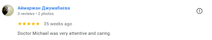Screenshot of a Google review with the reviewer's name in a non-Latin script, five-star rating, and text praising Dr. Michael for being attentive and caring. Médecin généraliste Français à Dubaï / GP / French GP / French Doctor / French family medici