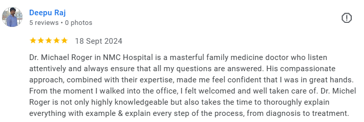 Screenshot of a Google review for Dr. Michael Roger with five stars, dated September 18, 2024, describing him as a masterful, knowledgeable, and compassionate family medicine doctor at NMC Hospital. Médecin généraliste Français à Dubaï / GP / French 
