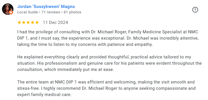 Screenshot of a 5-star review by Jordan 'Sussykween' Magno about their consultation with Dr. Michael Roger at NMC DIP 1, praising Dr. Roger's attentive and compassionate care. Médecin généraliste Français à Dubaï / GP / French GP / French Doctor / Fr