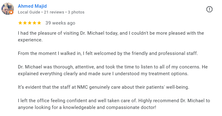 Screenshot of a Google review written by Ahmed Majid, praising Dr. Michael at a healthcare facility for being thorough, attentive, and caring, with five stars and 21 reviews. Médecin généraliste Français à Dubaï / GP / French GP / French Doctor / Fre