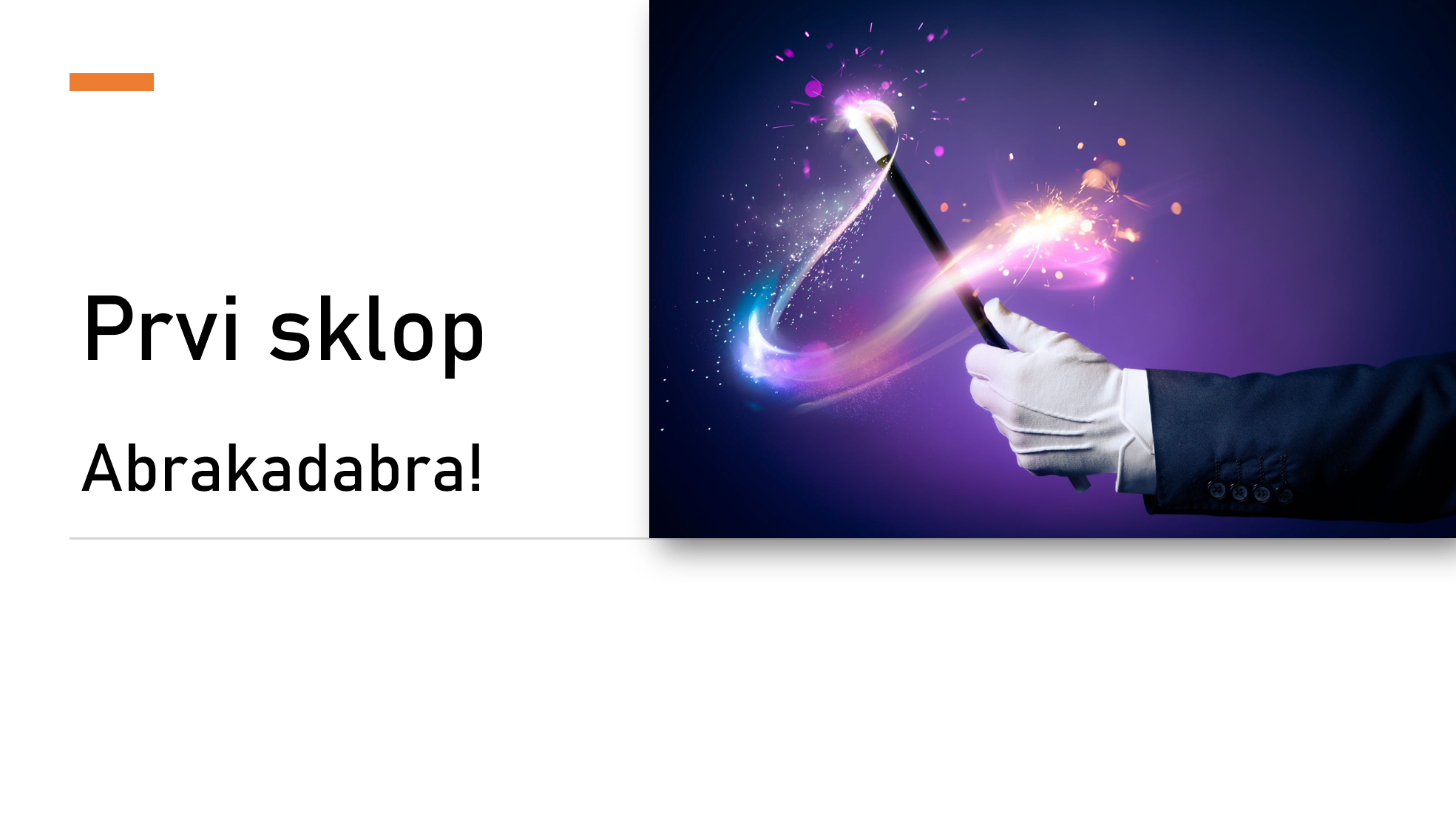 A magician's hand in a white glove holding a black magician's wand with colorful sparks and light effects coming from the tip against a purple background.