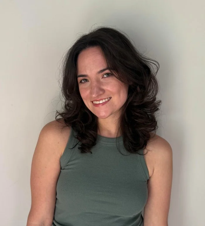 Headshot of Kelsey, smiling.