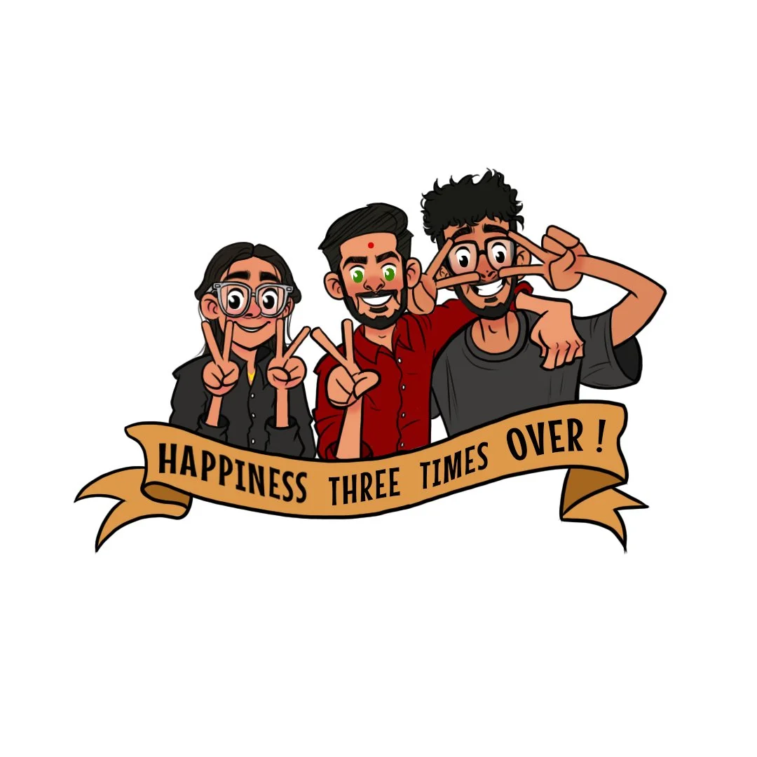 Three friends smiling and making peace signs, standing behind a banner that says "Happiness three times over!"