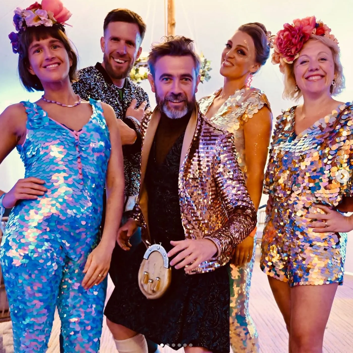 Host Kevin Campbell Davidson and DJ Max Galactic with a group of dancers ready for the Disco Ceilidh at Wilderness Festival 2025.