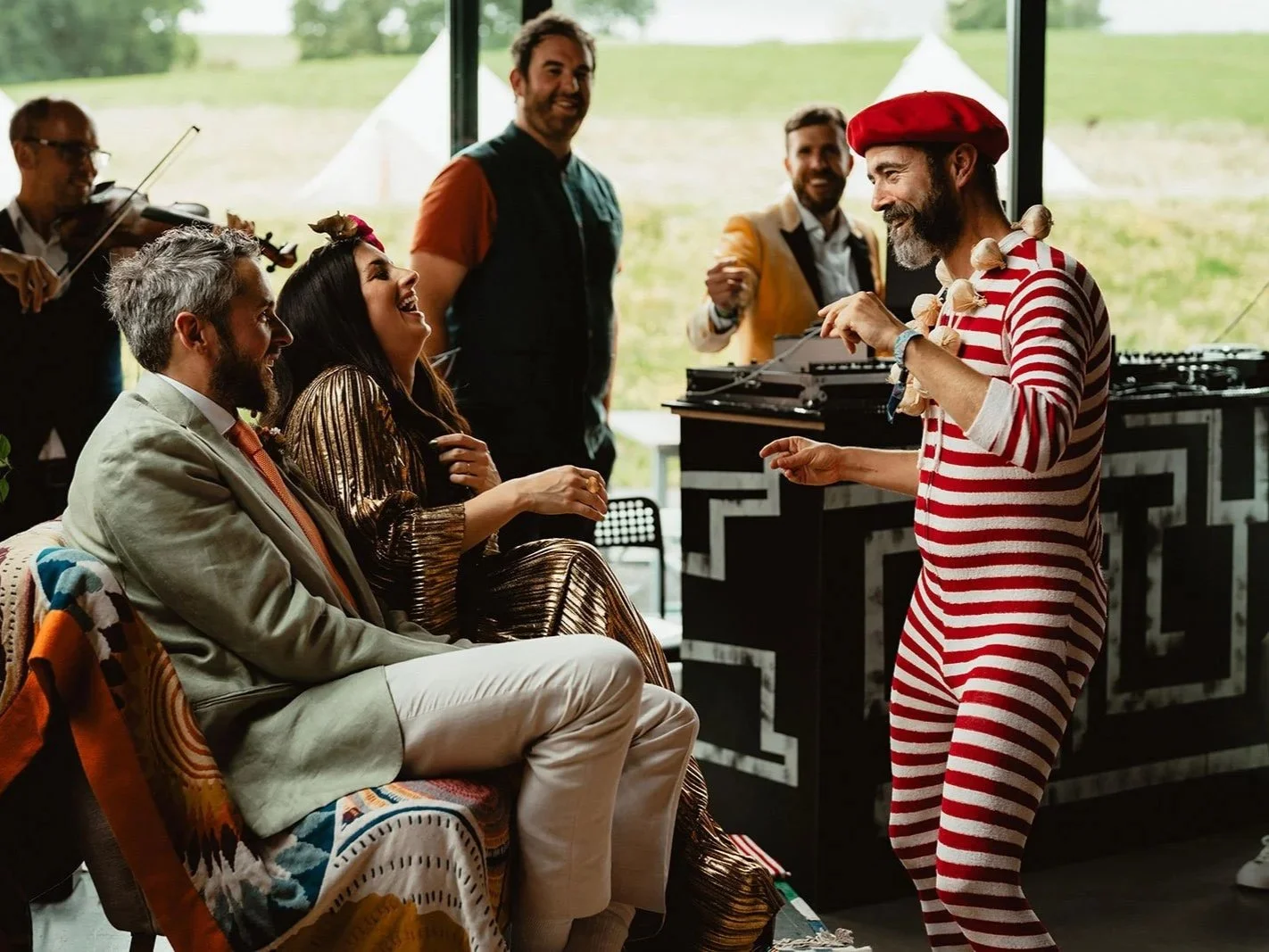 Host Kevin Campbell Davidson engaging a bride and groom in a Wedding Gameshow.