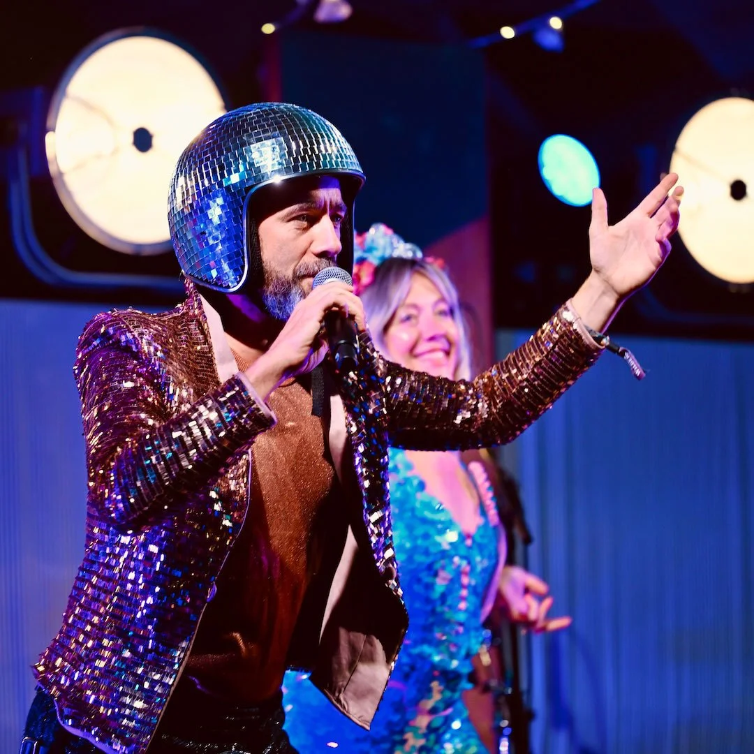Host Kevin Campbell Davidson leads a Disco Ceilidh in The Club House venue at Wilderness Festival in 2025.