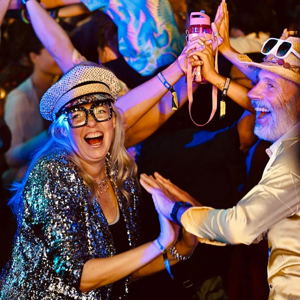 Dressed up guests having a blast at a Disco Ceilidh.