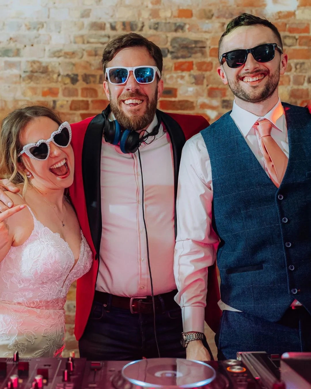 DJ Max Galactic with the bride and groom at a wedding.