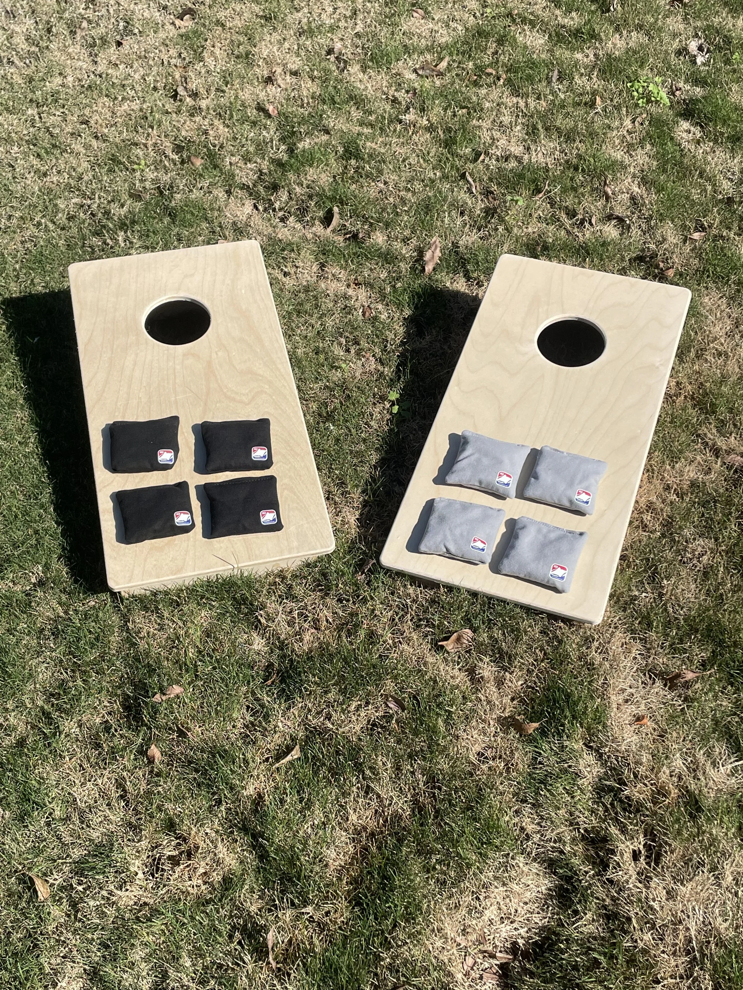 Travel Size Cornhole, with bags- 12 inches wide, 24 inches long with a 3-inch depth. 