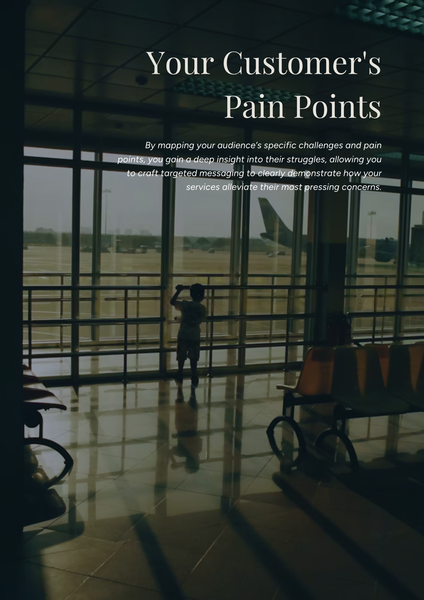 An airport waiting area with chairs, a young boy looking out the window at an airplane on the tarmac, and a large window showing the runway outside.