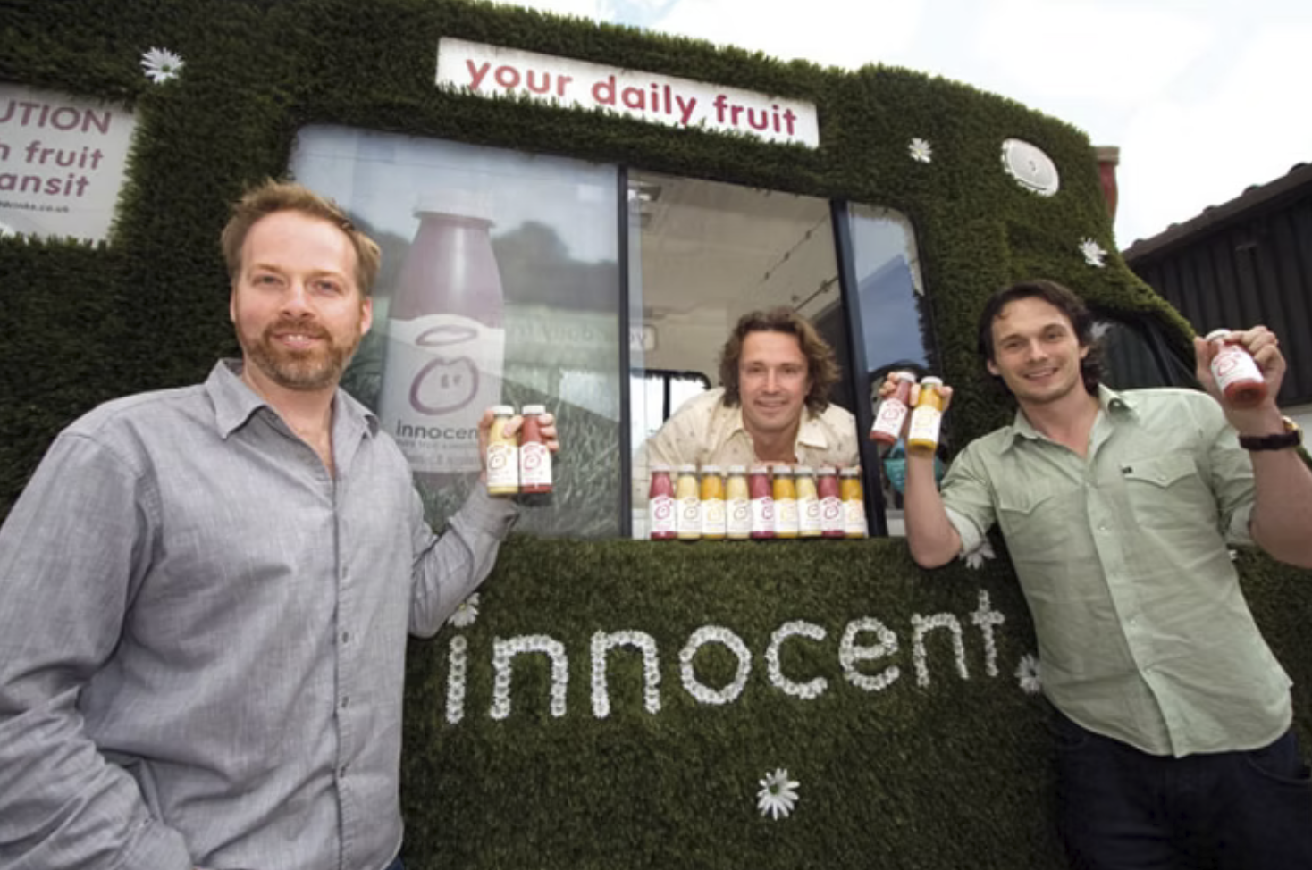 innocent-drinks founders in their grass covered van