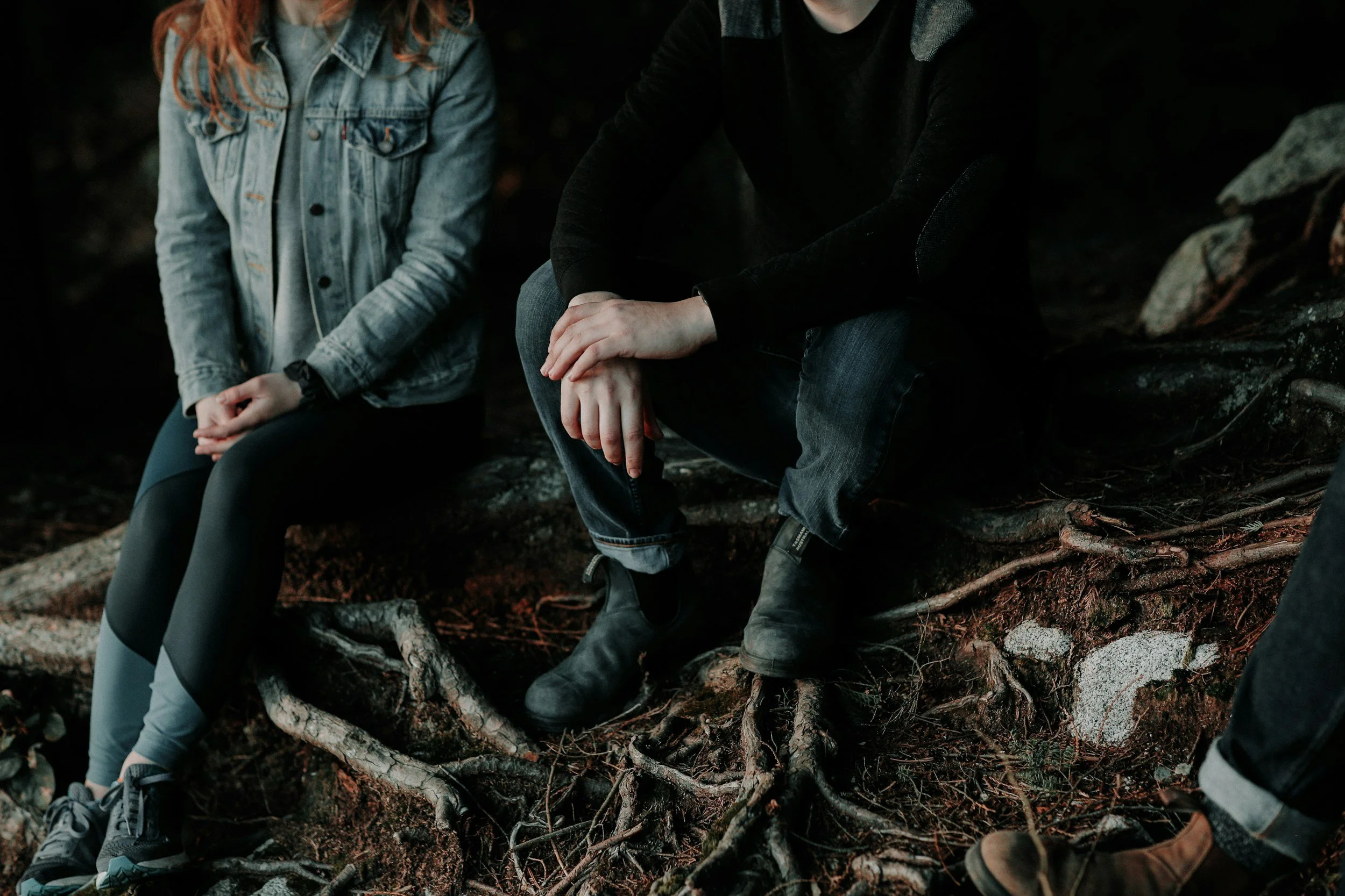 Couple sitting next to each other, but not toward one another.