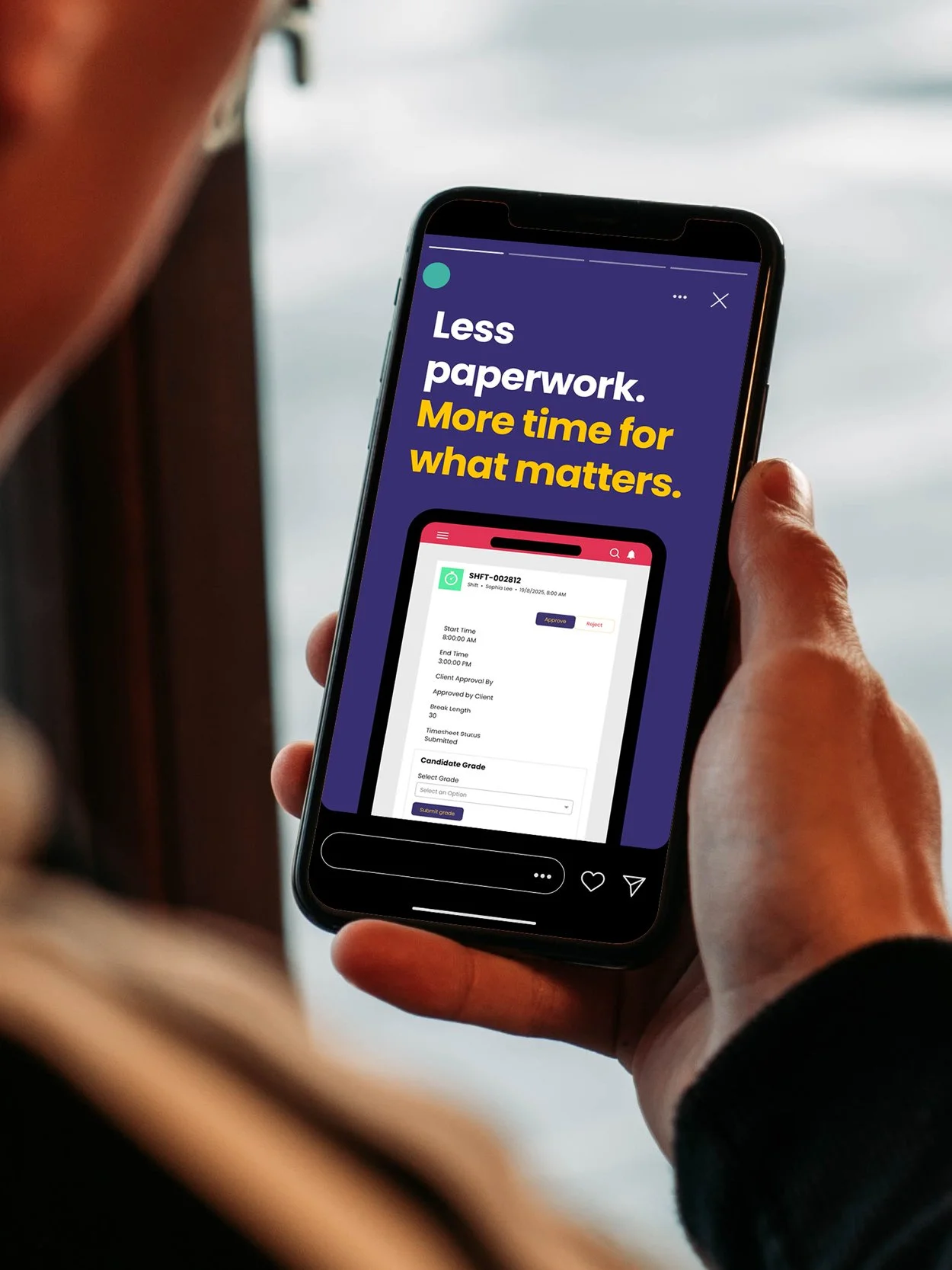 A person holding a smartphone displaying an app with the text 'Less paperwork. More time for what matters.'