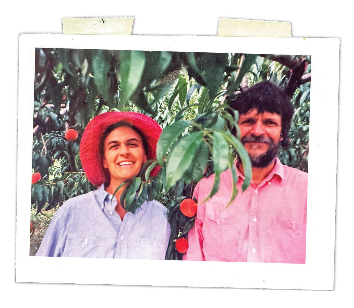 Samuel and Margaret Wenger Johnson stand in a peach orchard.