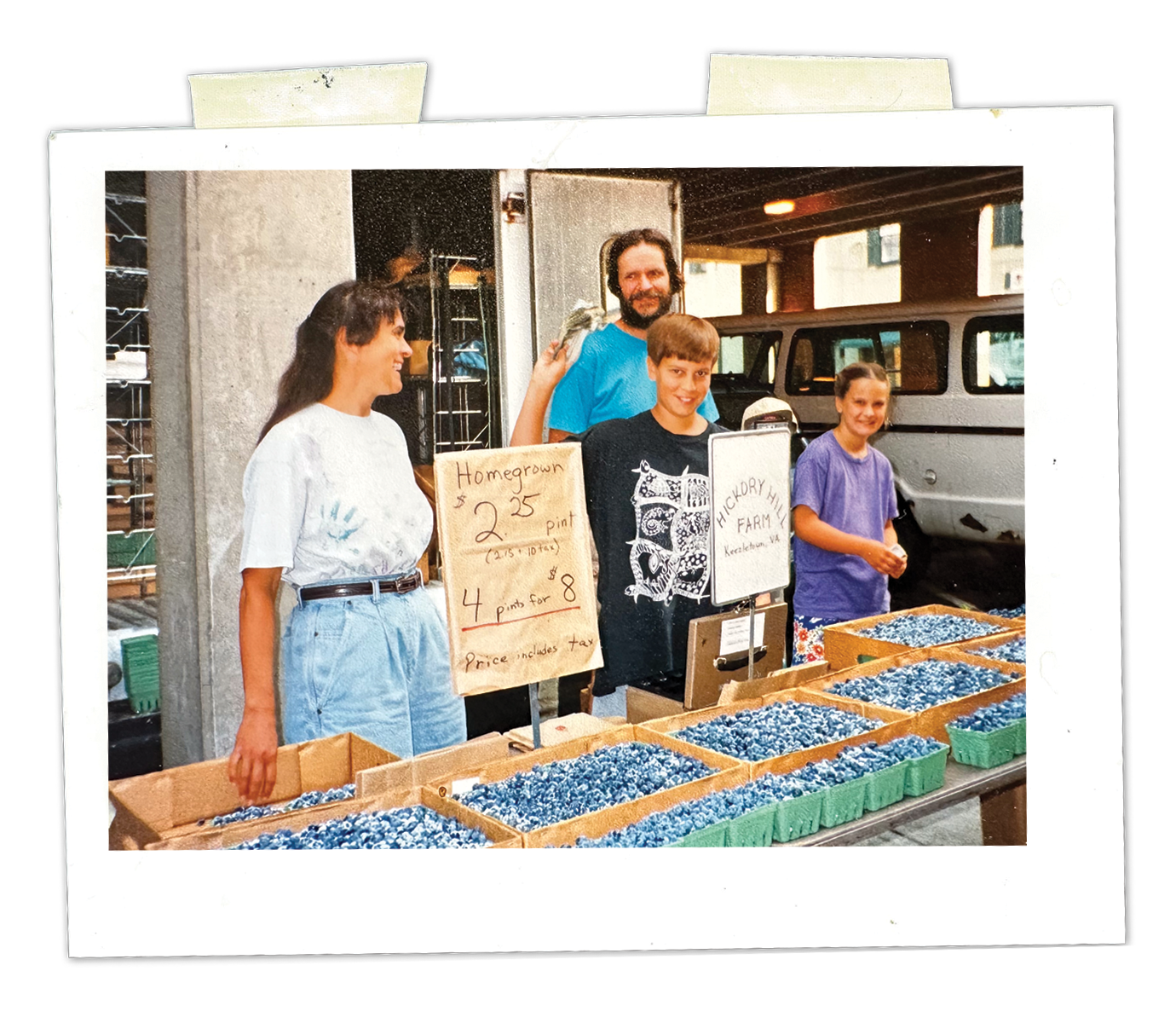 Samuel and Margaret Wenger Johnson and their two children sell blueberries at the Harrisonburg Farmers Market.