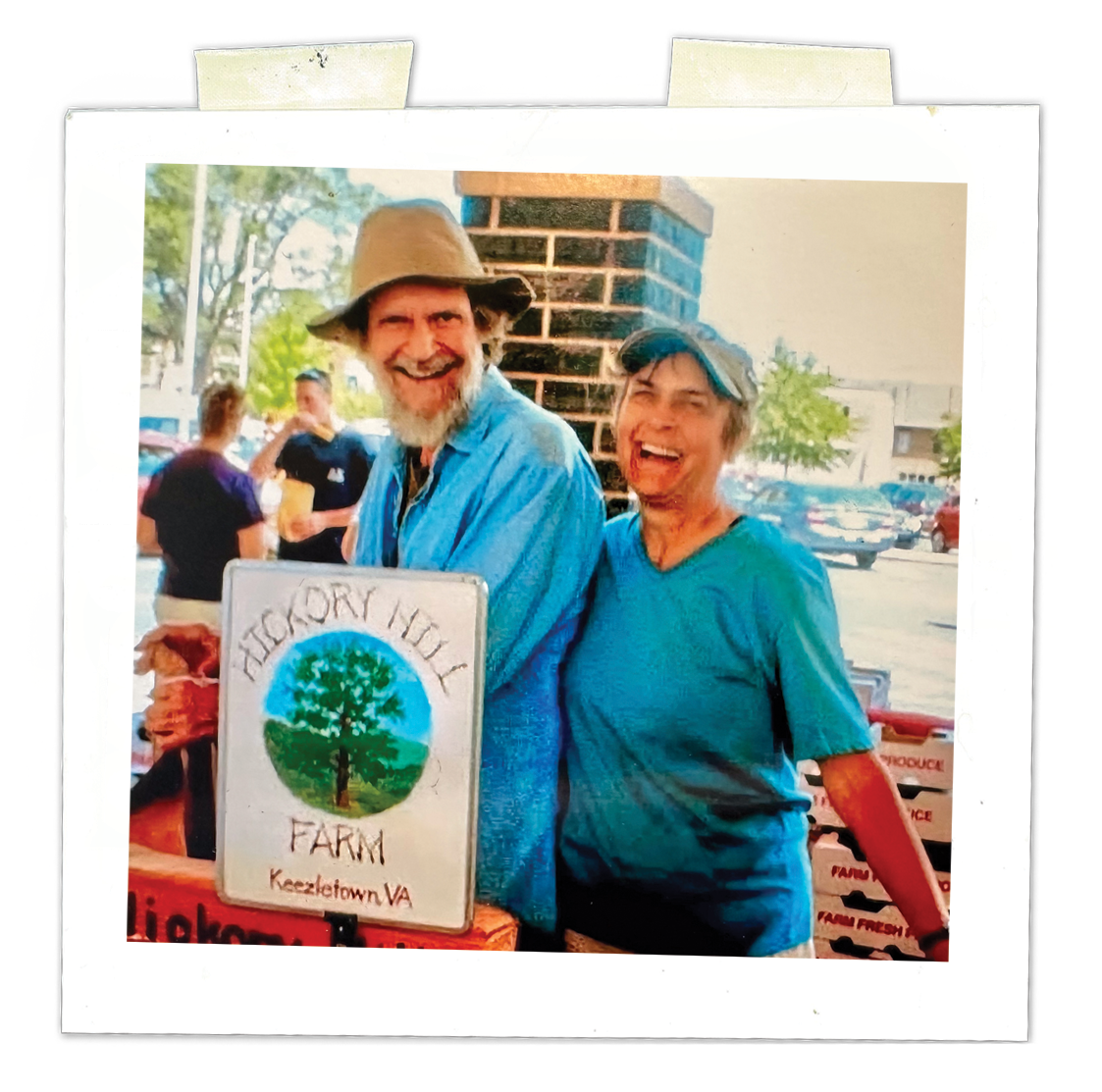 Samuel and Margaret Wenger Johnson, the owners of Hickory Hill Farm, stand at their produce stand at the Farmers Market in Harrisonburg, Virginia.