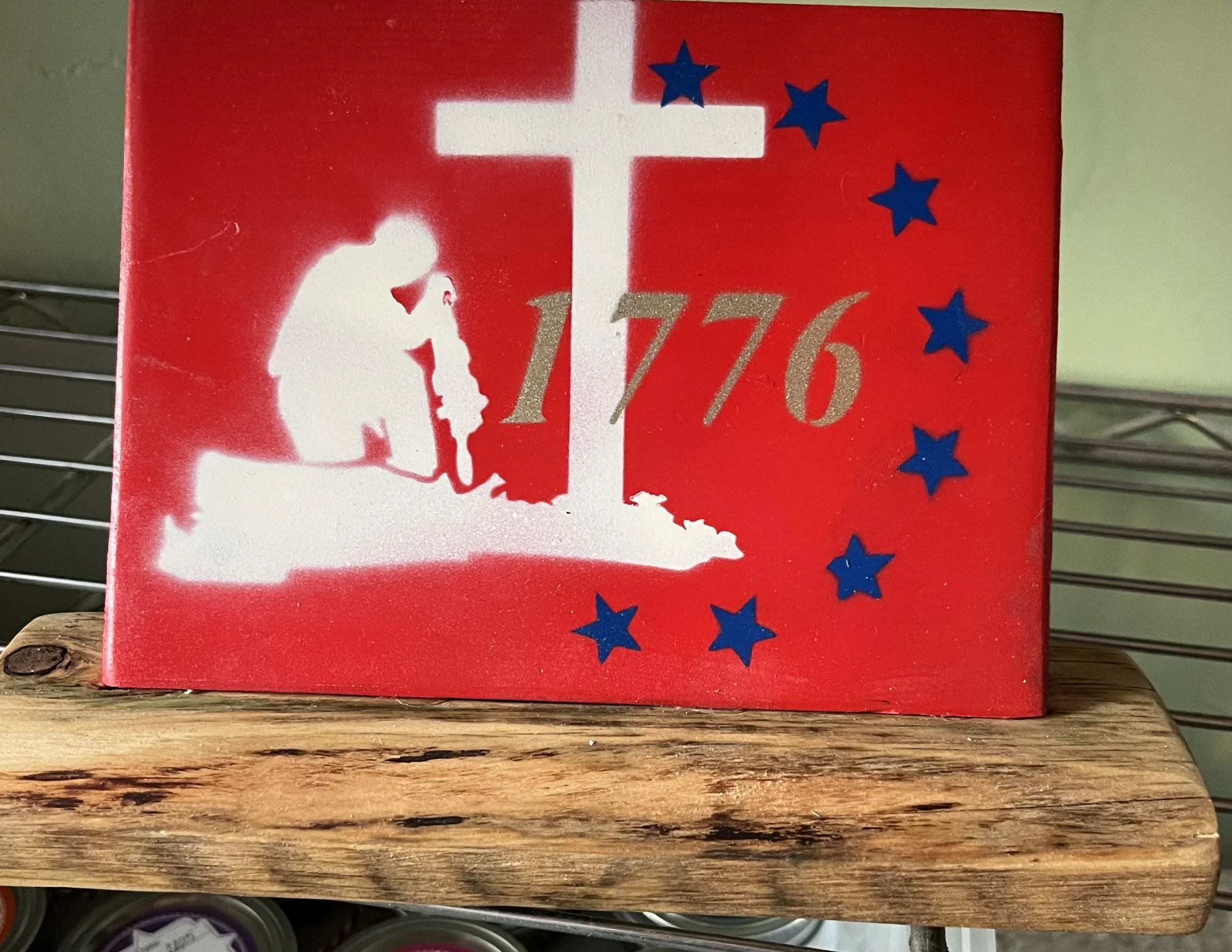 Red background Soldier kneeling at Cross