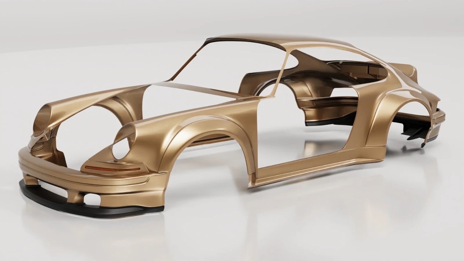 A gold-colored car body shell without wheels, doors, or windows on a white surface.