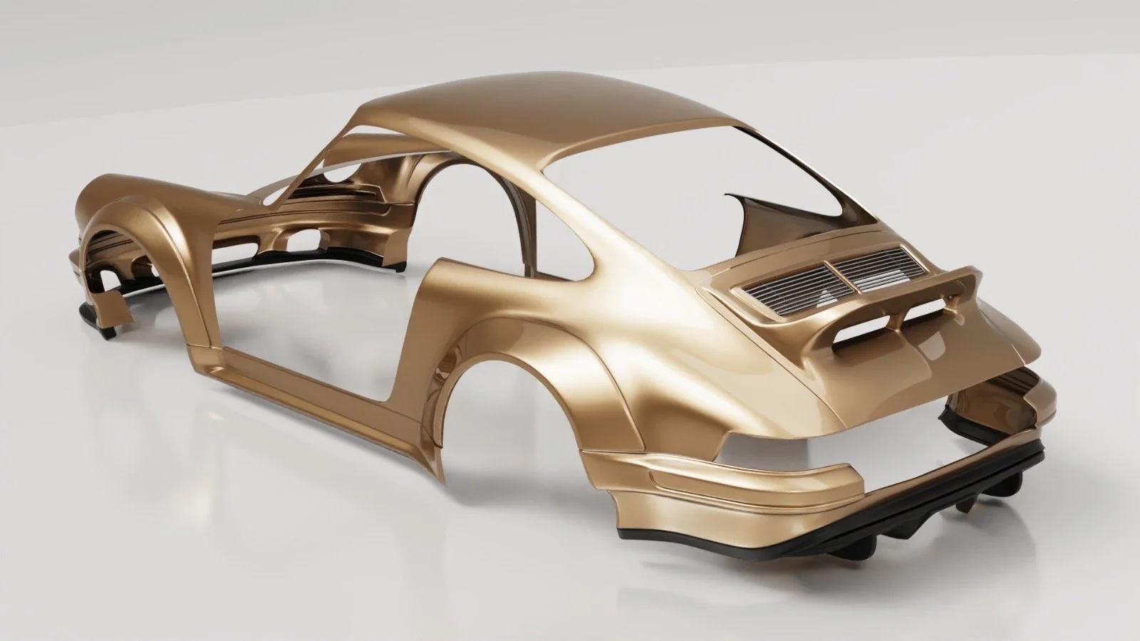 Unassembled gold-colored sports car body shell on a white surface.