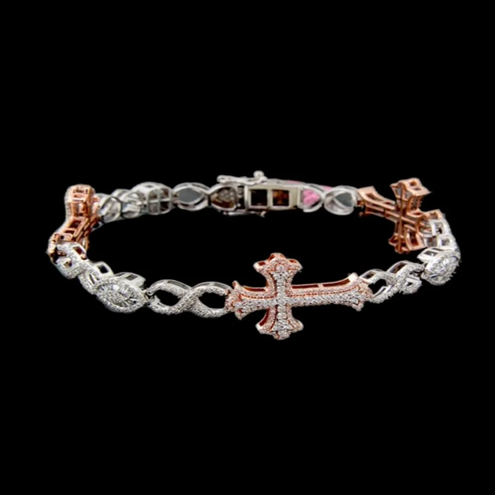 A jewelry bracelet with a cross pendant, made of silver-tone and rose gold-tone metals, adorned with small diamonds, against a black background.
