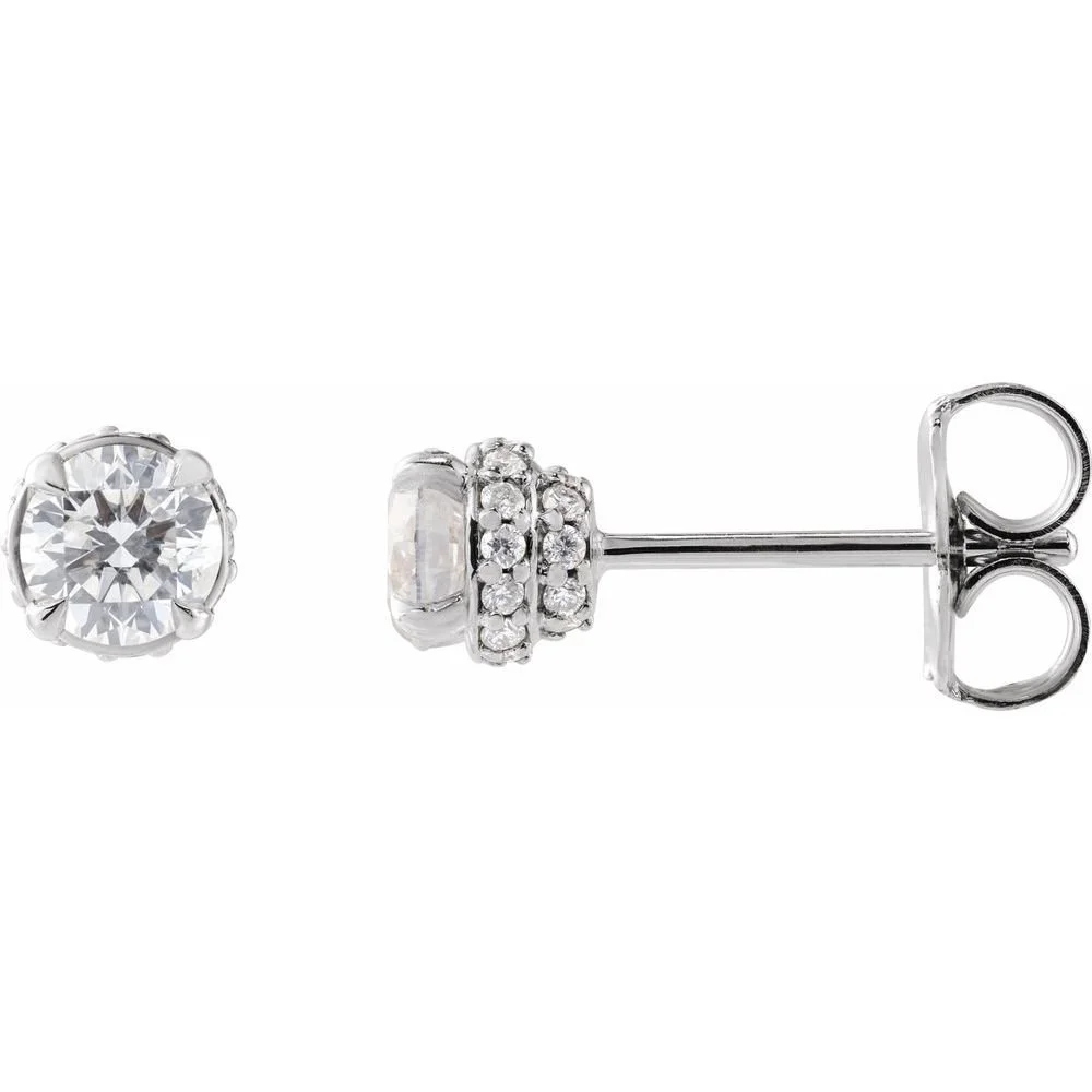 Diamond stud earring with a large central gemstone and smaller gemstones in a silver setting.