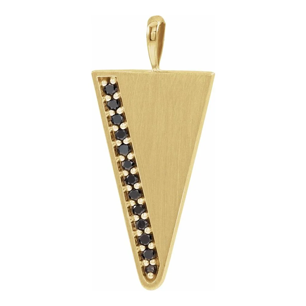 Gold pendant with a vertical row of black gemstones on one side.