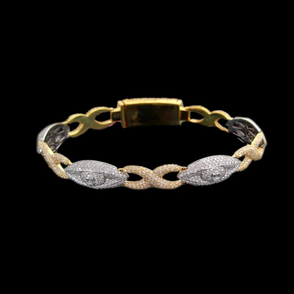 Gold and diamond bracelet with leaf-shaped design on a black background.