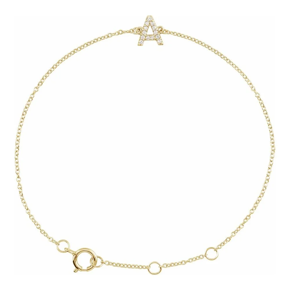 Gold necklace with an 'A' shaped pendant encrusted with small diamonds.