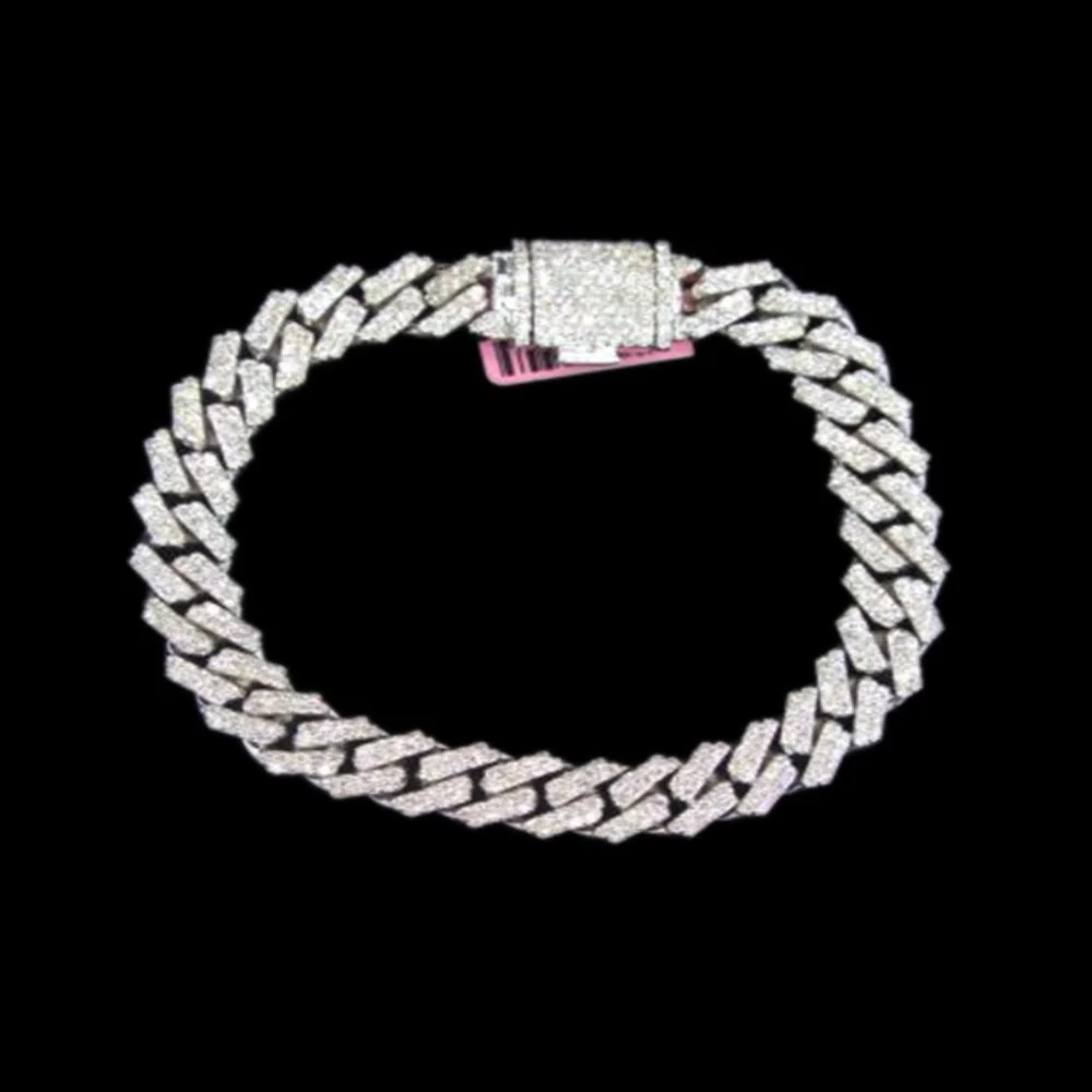 Diamond-encrusted chain bracelet with a clasp, displayed on a black background.