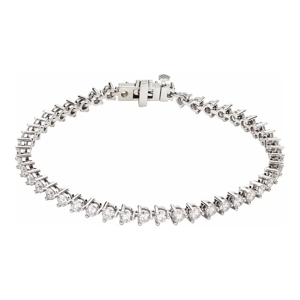 Silver bracelet with clear gemstones in a single row, clasped securely.