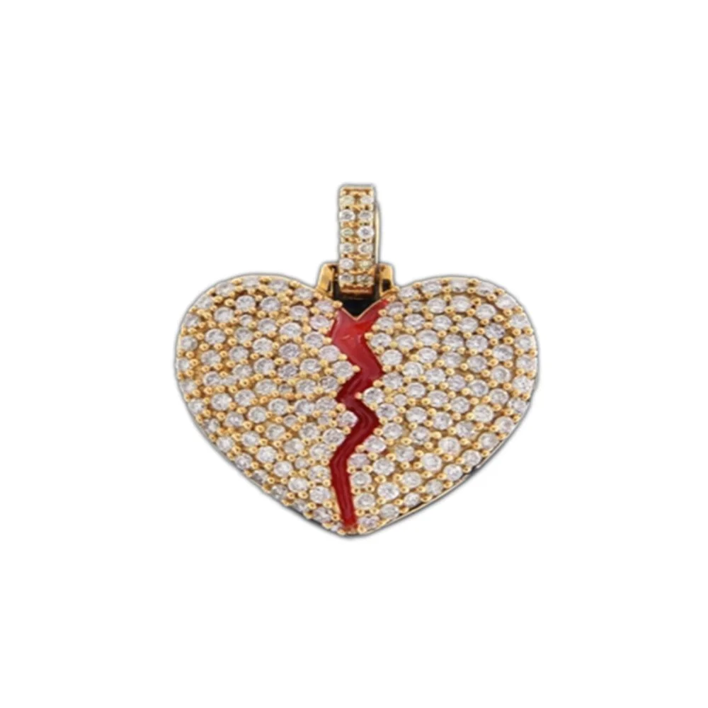 A heart-shaped pendant adorned with numerous small diamonds, featuring a red crack running through its center, set in gold with a diamond-encrusted bail.