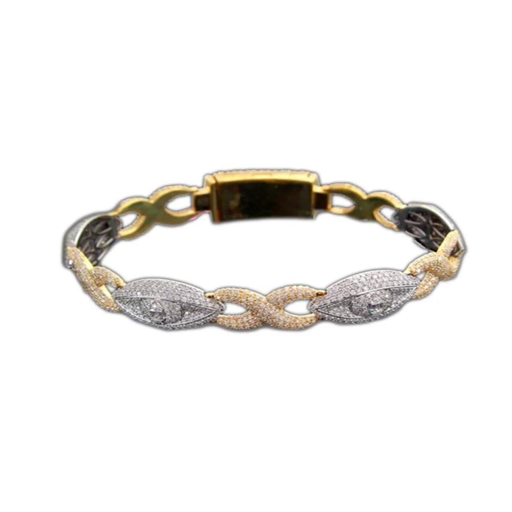 A bracelet with a chain-link design, featuring gold and silver-colored links adorned with small gemstones.
