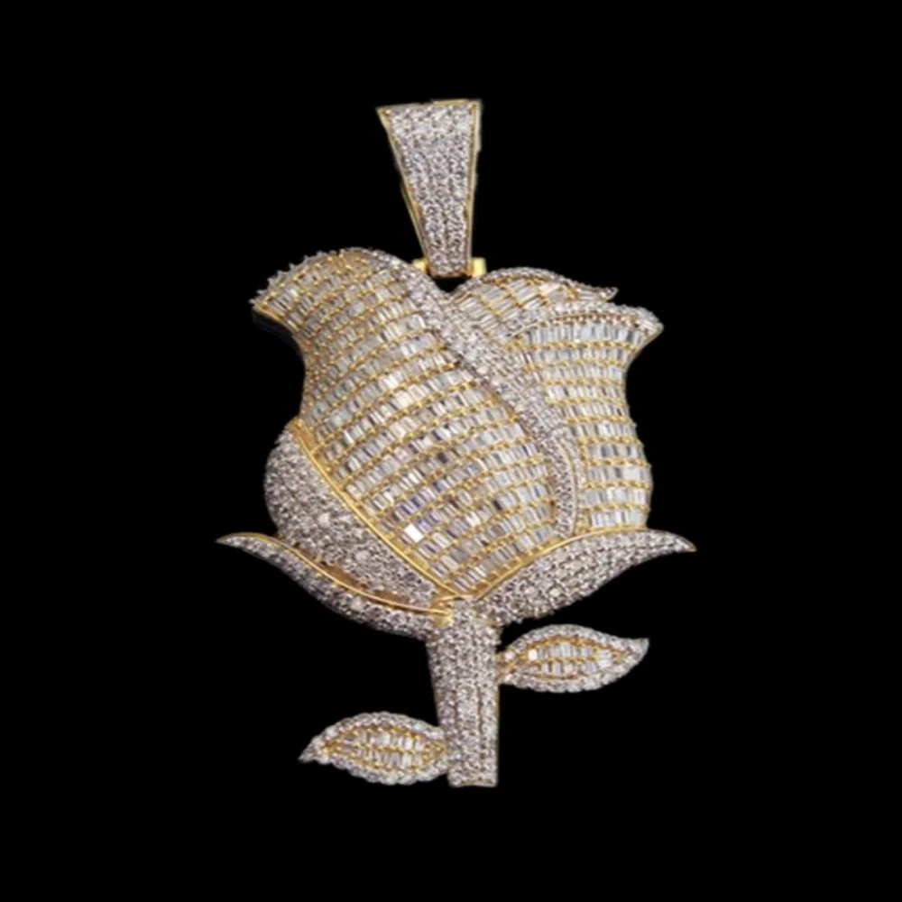 A gold and diamond pendant in the shape of a rose with a black background.
