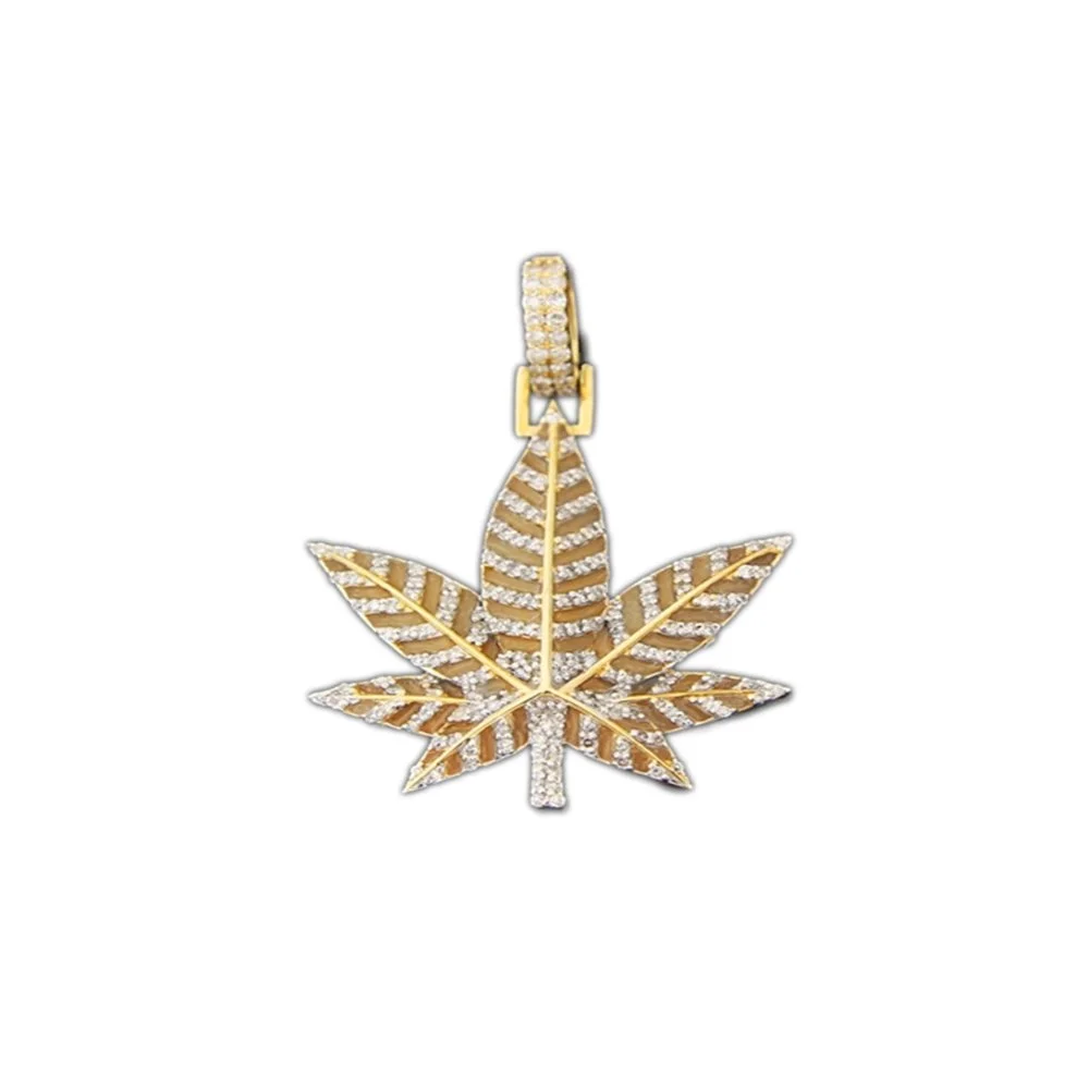 Gold pendant shaped like a cannabis leaf, decorated with small diamonds.