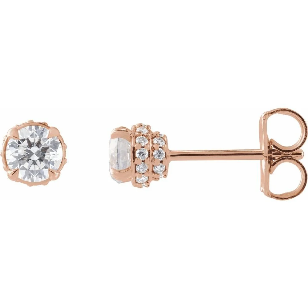 Rose gold stud earrings with clear gemstones, one earring shown from the front and the other from the side.