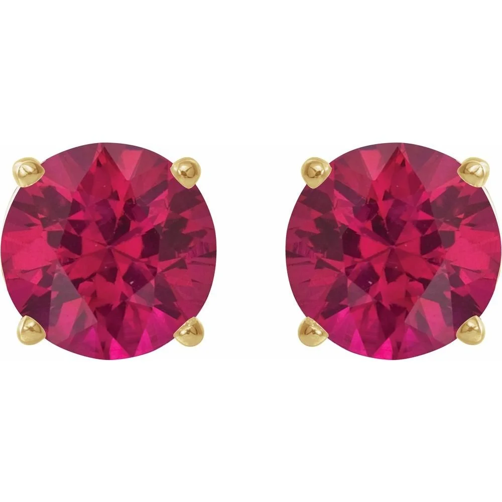 Pair of pink gemstone stud earrings with gold prongs
