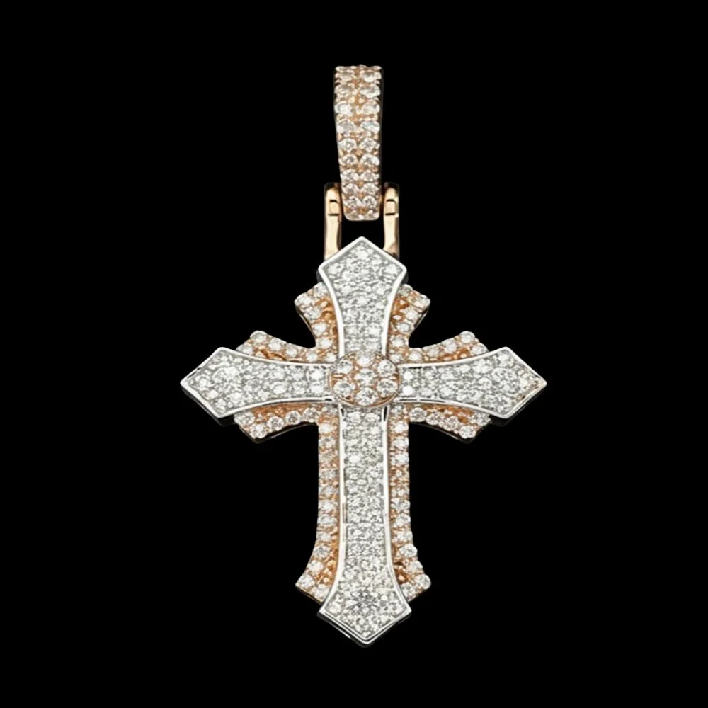 A gold and silver cross pendant encrusted with numerous diamonds, hanging from a diamond-studded bail.