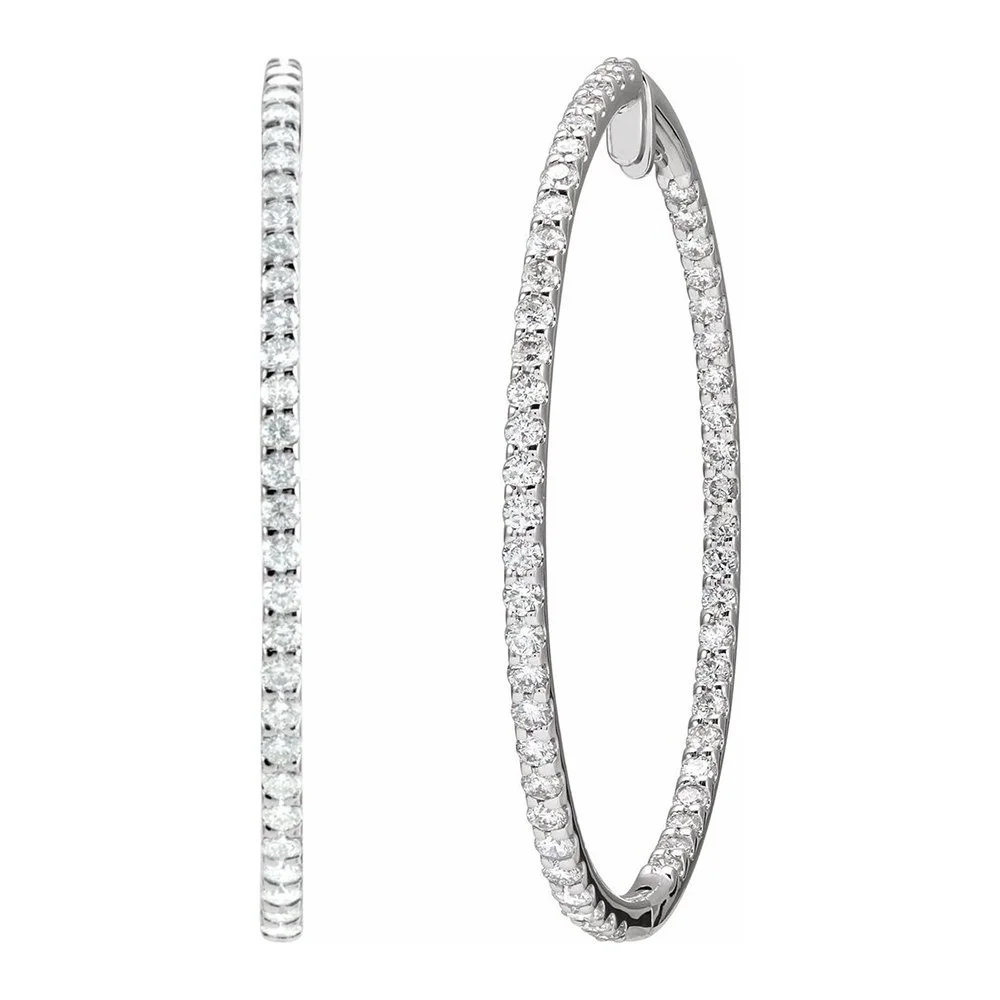Two diamond-studded rings, one thin and plain and the other a larger hoop with a clasp, both with sparkling diamonds.