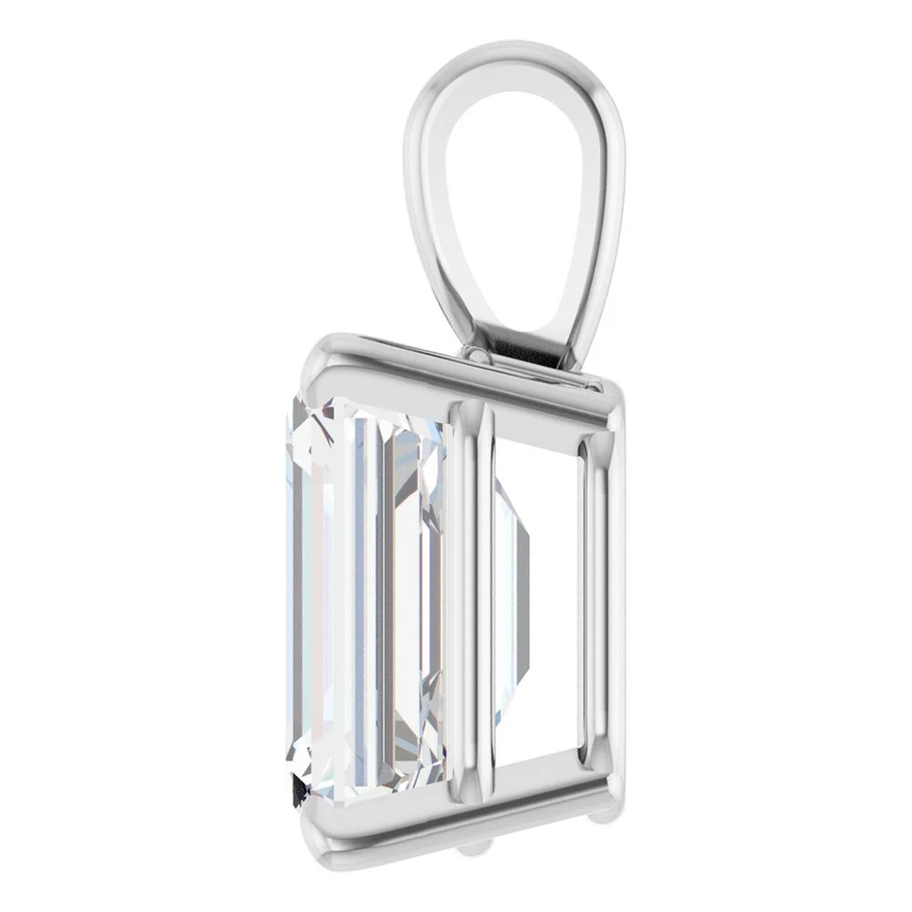 A silver pendant with a large rectangular clear gemstone set in a silver frame.