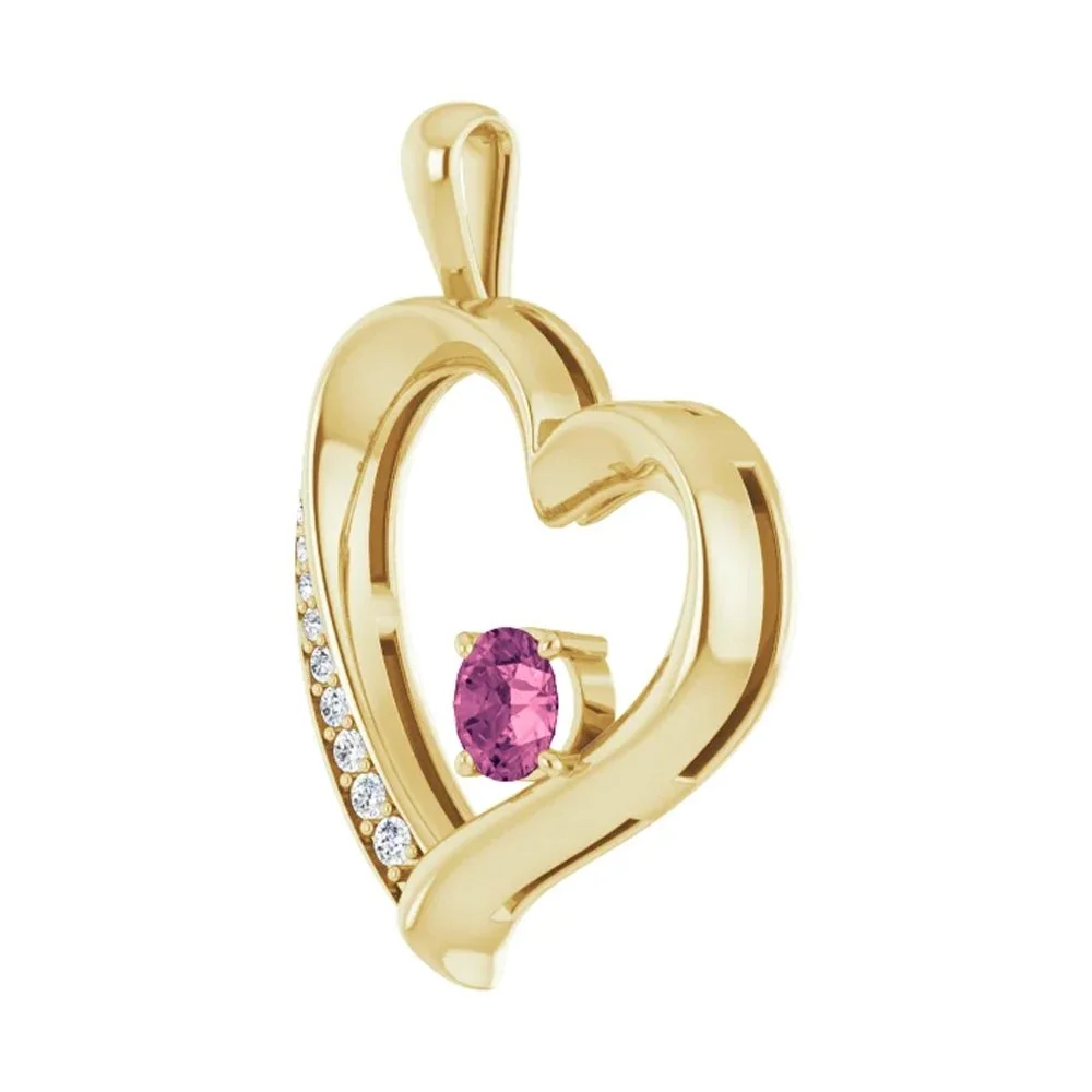 Gold heart-shaped pendant with a pink gemstone and small white diamonds.