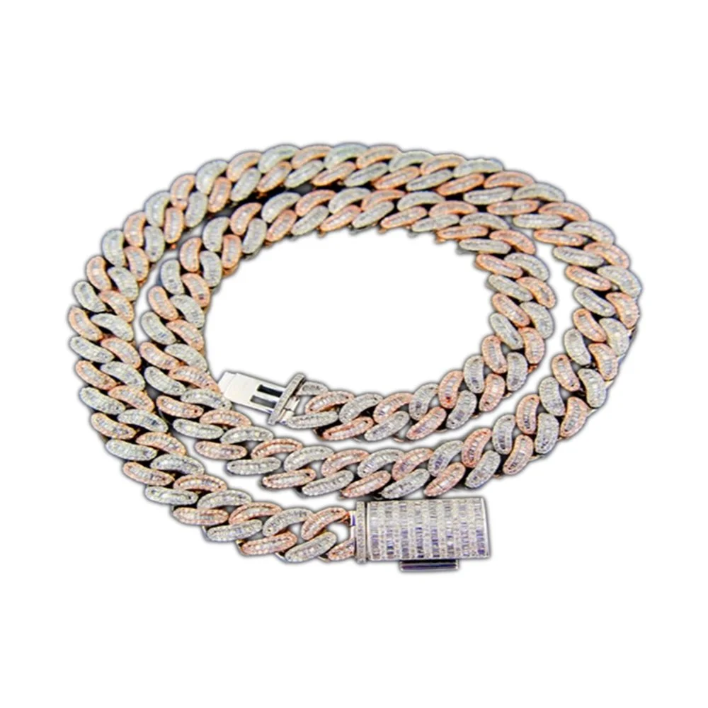 A gold and silver chain necklace with embedded diamonds and a clasp.