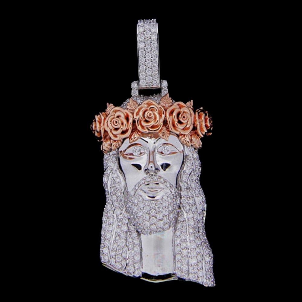 Silver and gold Jesus face pendant with a crown of roses and diamond accents on a black background.