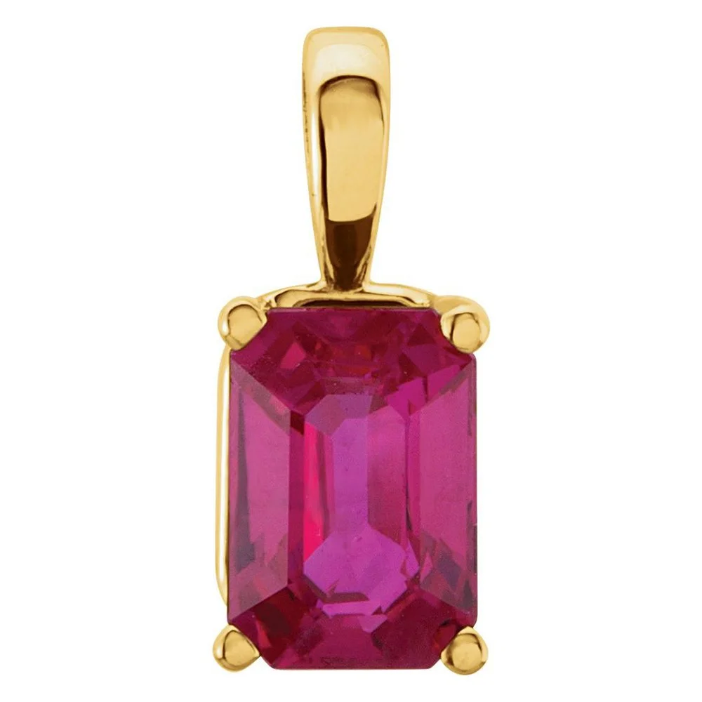 Gold pendant with a large rectangular pink gemstone