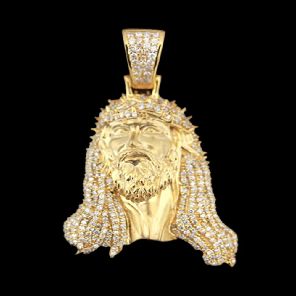 Gold pendant of Jesus Christ's face with a crown of thorns, adorned with numerous small diamonds, with a black background.